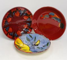 Three Poole Pottery ‘Delphis’ wall plates, 25cm