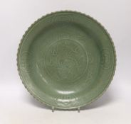 A large Chinese celadon glazed plate, 30cm