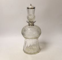 A George V silver mounted cut glass thistle shaped decanter and stopper, Wolfsky & Co Ltd, London,