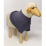 A Hanns-Peter Krafft sheep for Mayr Wool, beech body with wool and leather details, 46cm high