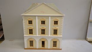 A modern Georgian style dolls house and accessories, the house is divided into six rooms on three