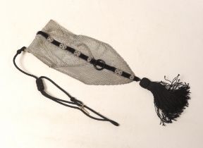 A 1920's silver mesh and black sash with tassel mounted evening bag, with black suspension cord,