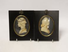 Attributed to Leslie Ray, pair of 20th century wax relief portraits of a lady and gentleman