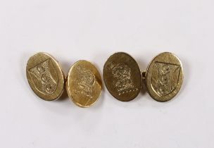 A pair of 1980's heavy 9ct gold oval cufflinks, with engraved crests, 16.2 grams.