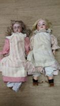 German doll with original shoes, clothes and wig in good condition, pierced ears, marked 79