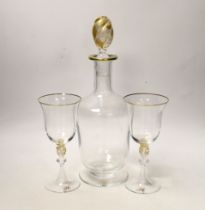 A Venetian glass decanter and two matching glasses, each with a gilt ‘H’ to foot. Tallest 32cm