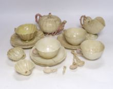A quantity of Belleek including a teapot, three cups and saucers and a shell design vase, mostly