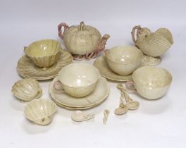 A quantity of Belleek including a teapot, three cups and saucers and a shell design vase, mostly