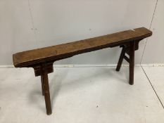 A Chinese Provincial fruitwood bench, width 116cm, height 54cm