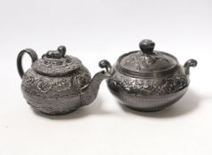 A Jackfield type Staffordshire teapot and lidded bowl, largest 17cm wide