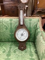 A late Victorian oak aneroid barometer and thermometer, height 78cm