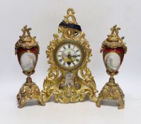 An early 20th century French gilt metal clock garniture, 30cm