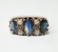 An early 20th century 18ct and graduated three stone sapphire set half hoop ring, with diamond