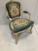 A Louis XVI style painted fauteuil with floral needlework upholstery, width 56cm, depth 50cm, height