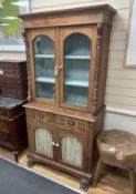 A 19th century Anglo Indian carved hardwood glazed cabinet, width 96cm, depth 47cm, height 194cm