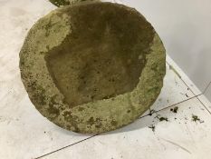 A circular millstone table, diameter 62cm, height 47cm