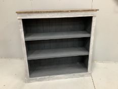 A Victorian style painted marble top open bookcase, width 118cm, depth 40cm, height 118cm