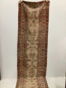 An antique North West Persian ivory ground runner (severely worn), 470 x 92cm