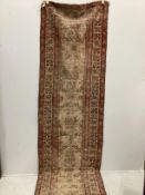 An antique North West Persian ivory ground runner (severely worn), 470 x 92cm