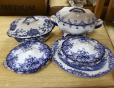 Two blue and white soup tureens and two vegetable tureens and a meat dish