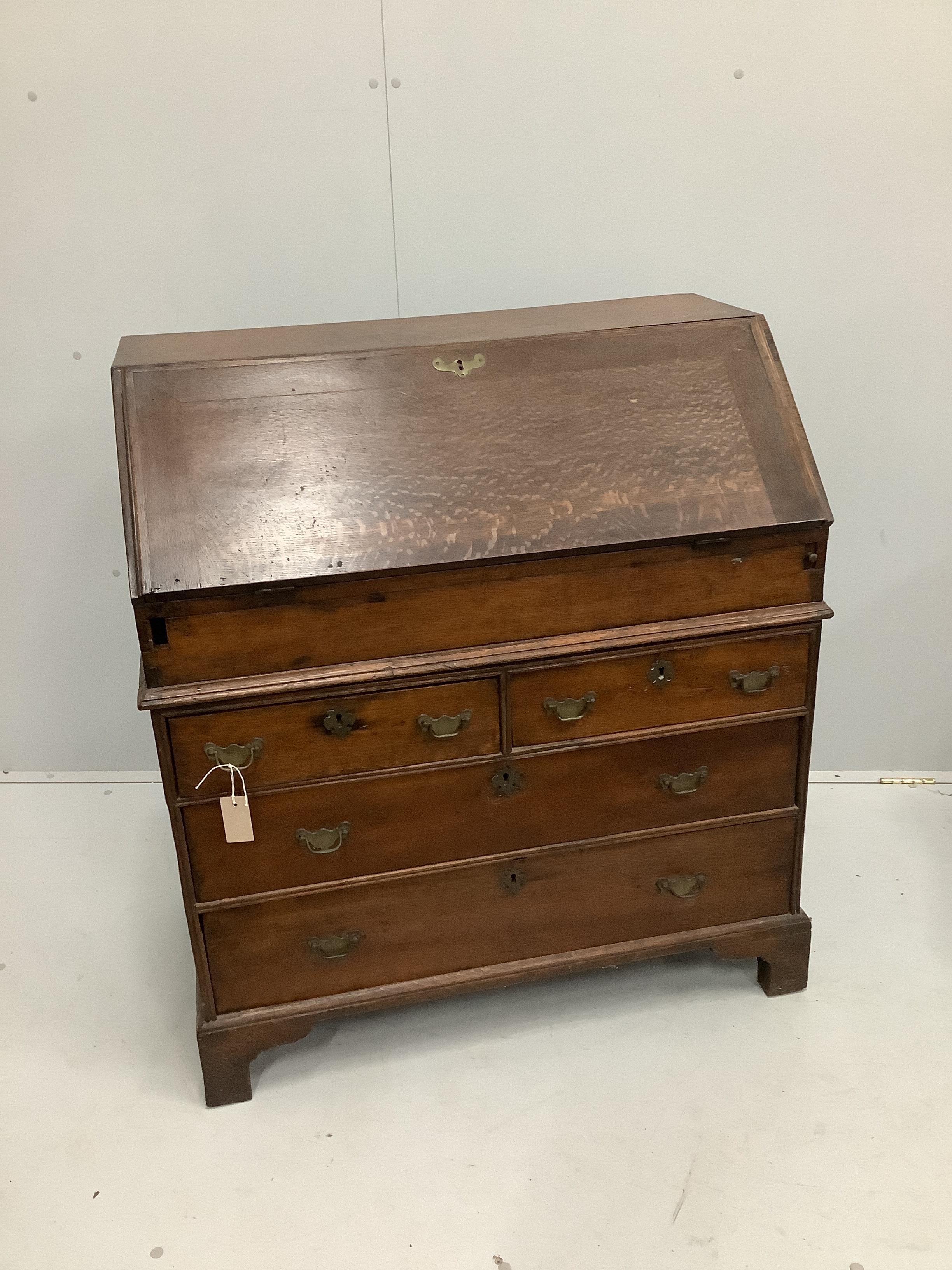 A mid 18th century oak bureau, width 91cm, depth 52cm, height 102cm