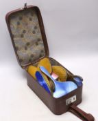 A George V silver and blue enamel five piece mirror and brush set, Birmingham, 1929 and a similar