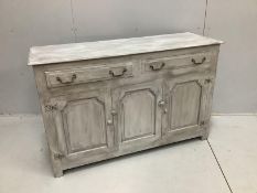 An 18th century style oak sideboard, later painted, width 137cm, depth 46cm, height 87cm