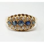 A George V 18ct gold, sapphire and diamond cluster set navette shaped ring, size N, gross weight 2.7
