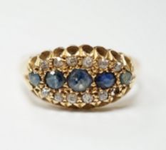 A George V 18ct gold, sapphire and diamond cluster set navette shaped ring, size N, gross weight 2.7