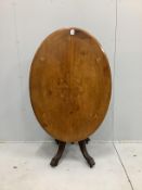 A late Victorian oval inlaid walnut tilt top loo table, length 116cm, width 84cm, height 72cm