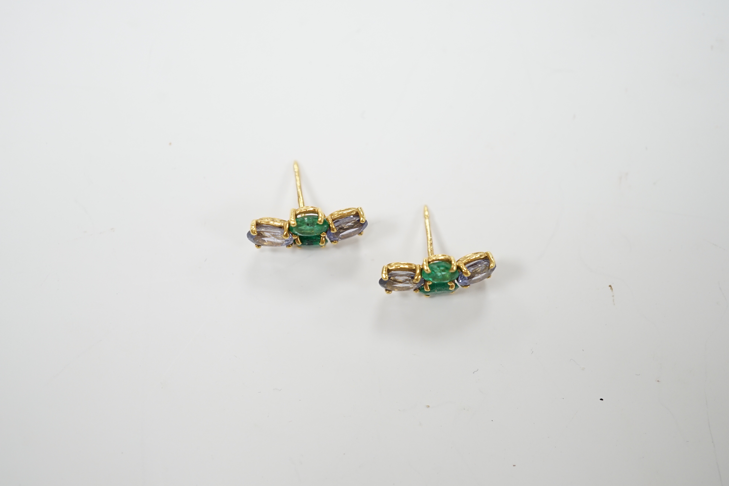 A modern pair of 18ct gold, two stone emerald and two stone sapphire set ear studs, 15mm by 7mm, - Image 3 of 4