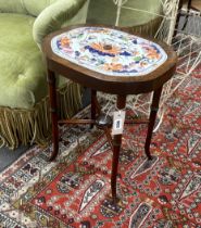 A pair of American walnut tables, each inset with Mason’s ironstone strainer panels, 47cm high