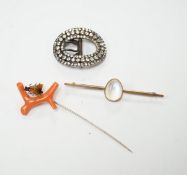 A 9ct and cabochon moonstone set bar brooch, 63mm, a coral and horn set bug stick pin and a paste