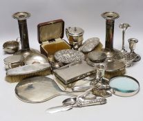 Sundry silver items including a pair of candlesticks, marks rubbed, handled magnifying glass, lidded