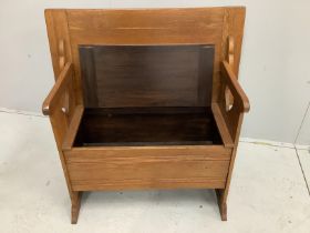 A small pale oak monk's bench with hinged box seat, width 91cm, depth 48cm, height 72cm