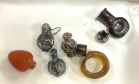 Miniature antiquities, including glass beads and miniature vessels, some possibly thought to be