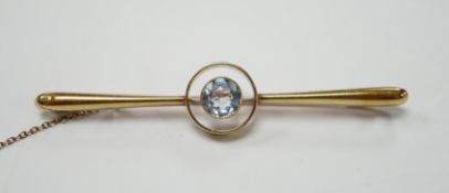 An Edwardian 15ct and single stone blue topaz set bar brooch, 60mm, gross weight 4.1 grams.