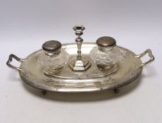 A Victorian engraved silver oval two handled inkstand, with two mounted glass wells and a