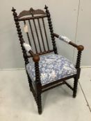 A 19th century Continental bobbin turned elbow chair, width 48cm, depth 42cm, height 99cm