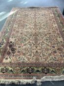 A North West Persian style peach ground carpet, 306 x 205cm