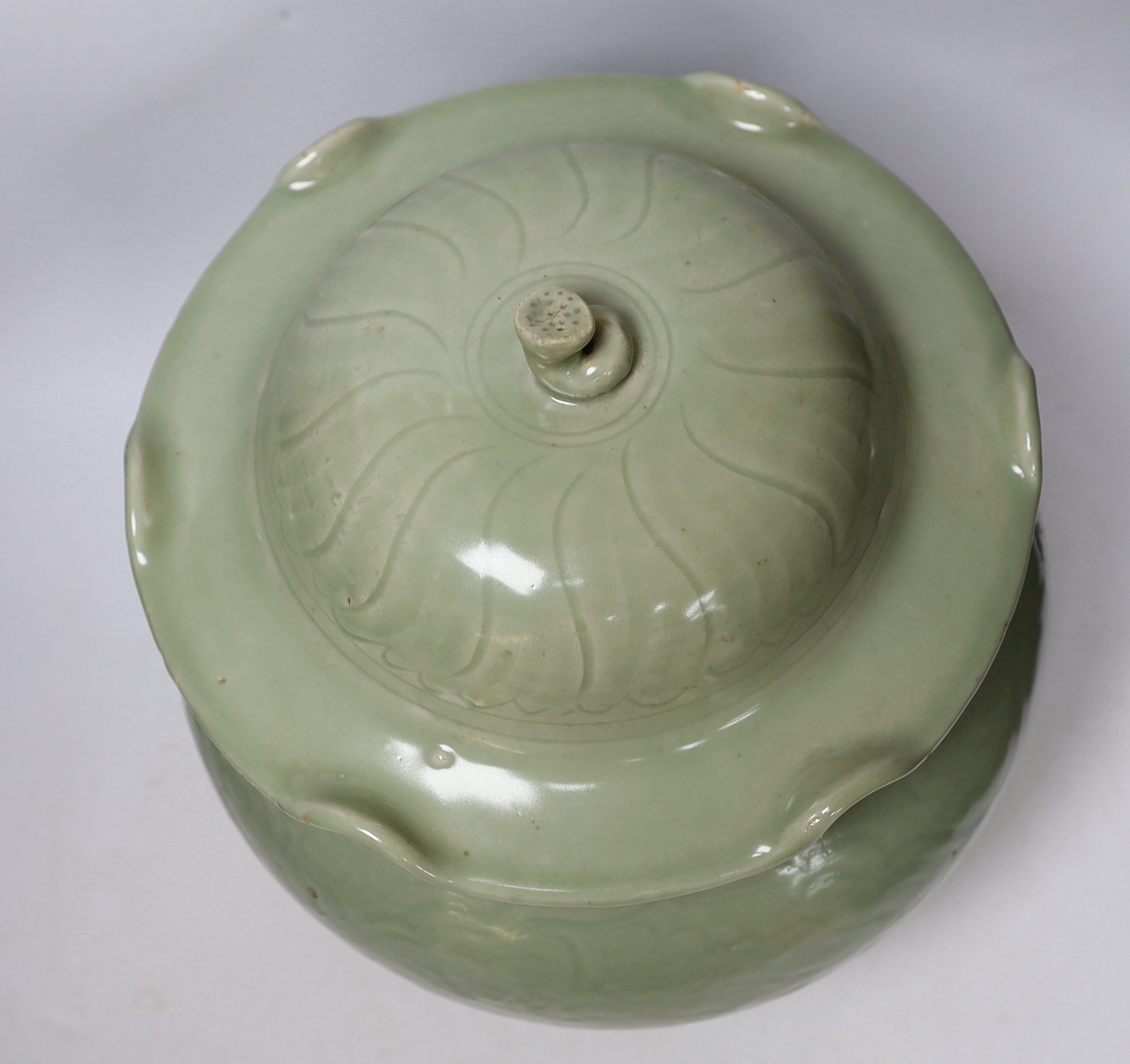 A large Chinese celadon jar and cover, Ming dynasty or later, the lotus leaf shaped cover above a - Image 3 of 5