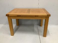 A contemporary oak draw leaf extending dining table, width 200cm extended, depth 80cm, height 78cm