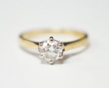 A modern 18ct gold and solitaire set diamond ring, the stone weighing 0.50ct, gross weight 2.2