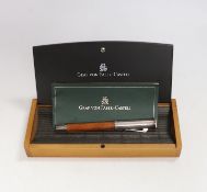 A cased Graf von Faber-Castell fountain pen with wooden handle