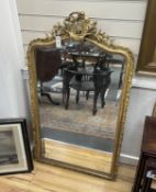 A 19th century French carved giltwood and composition wall mirror, width 75cm, height 129cm