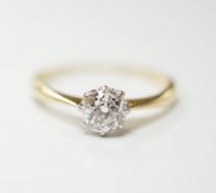 A yellow metal and solitaire diamond ring, stone diameter 5.1mm, size L, gross weight 1.8 grams.