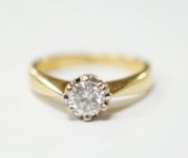 A modern 18ct gold and solitaire diamond set ring, the stone weighing 0.33ct, size I, gross weight