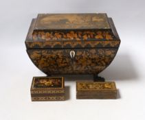 A Regency penwork tea caddy, the cover inset with an engraving of figures by a castle, 23.5 x 16 x