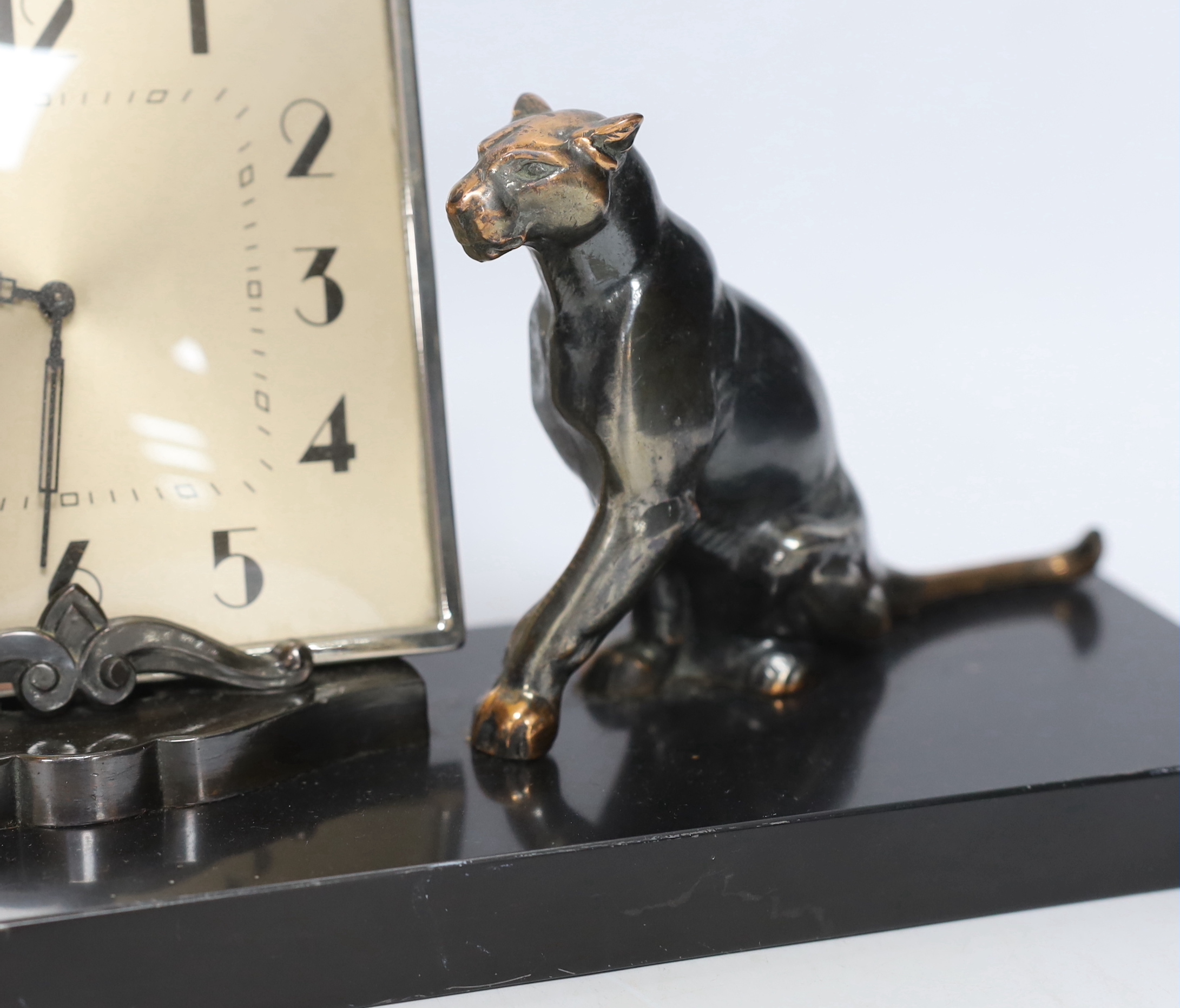 A patinated spelter Art Deco clock surmounted with two panthers, 40cm high - Image 3 of 4