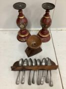 A pair of painted baluster pricket candlesticks, height 39cm, a spoon rack, pewter spoons and a